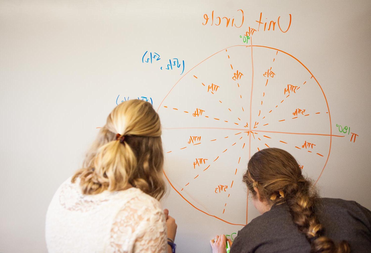 Students working on a whiteboard